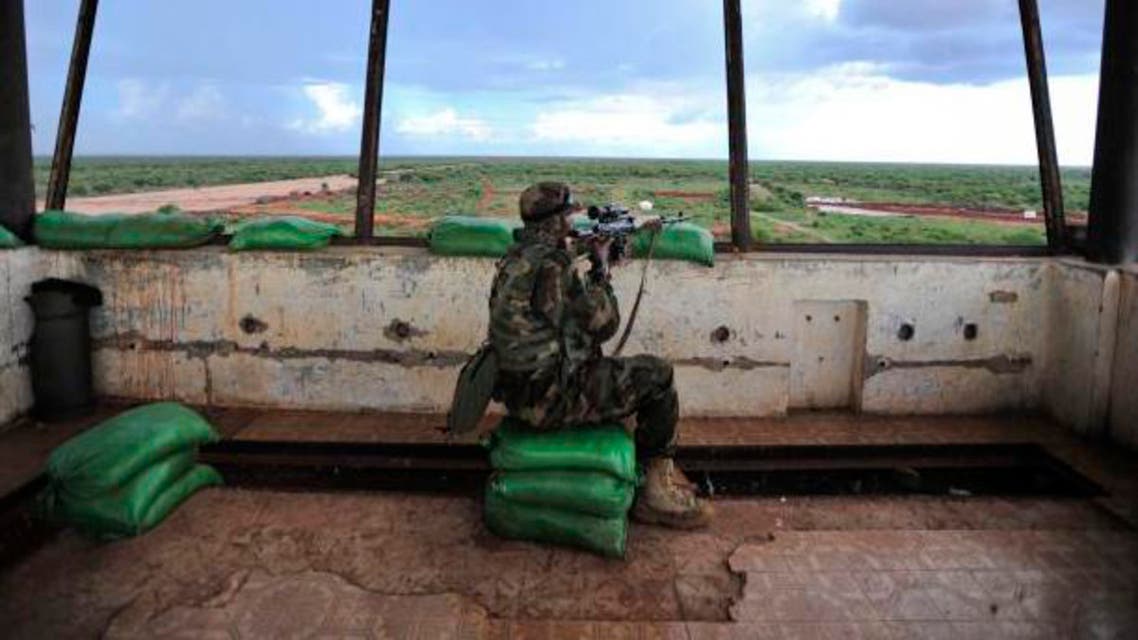 A sniper in a control tower checks surrounding areas for al-Shabaab militants (Handout/Courtesy Reuters).