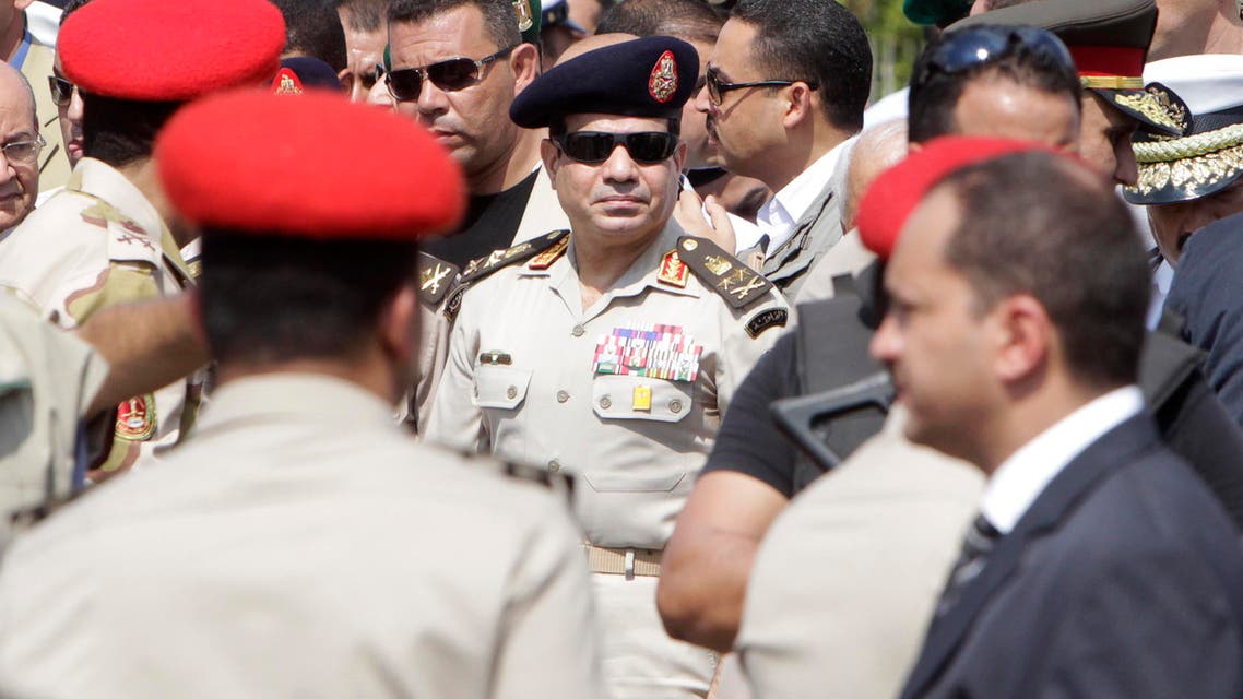 Army Chief General Abdel Fattah al-Sisi (C) attends the military funeral service of Police General Nabil Farag, who was killed on Thursday in Kerdasa, at Al-Rashdan Mosque in Cairo's Nasr City district September 20, 2013. 