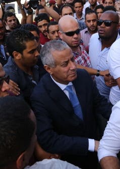 Libyan Prime Minister Ali Zeidan arrives at the government headquarters in Tripoli on October 10, 2013 shortly after he was freed. (AFP)