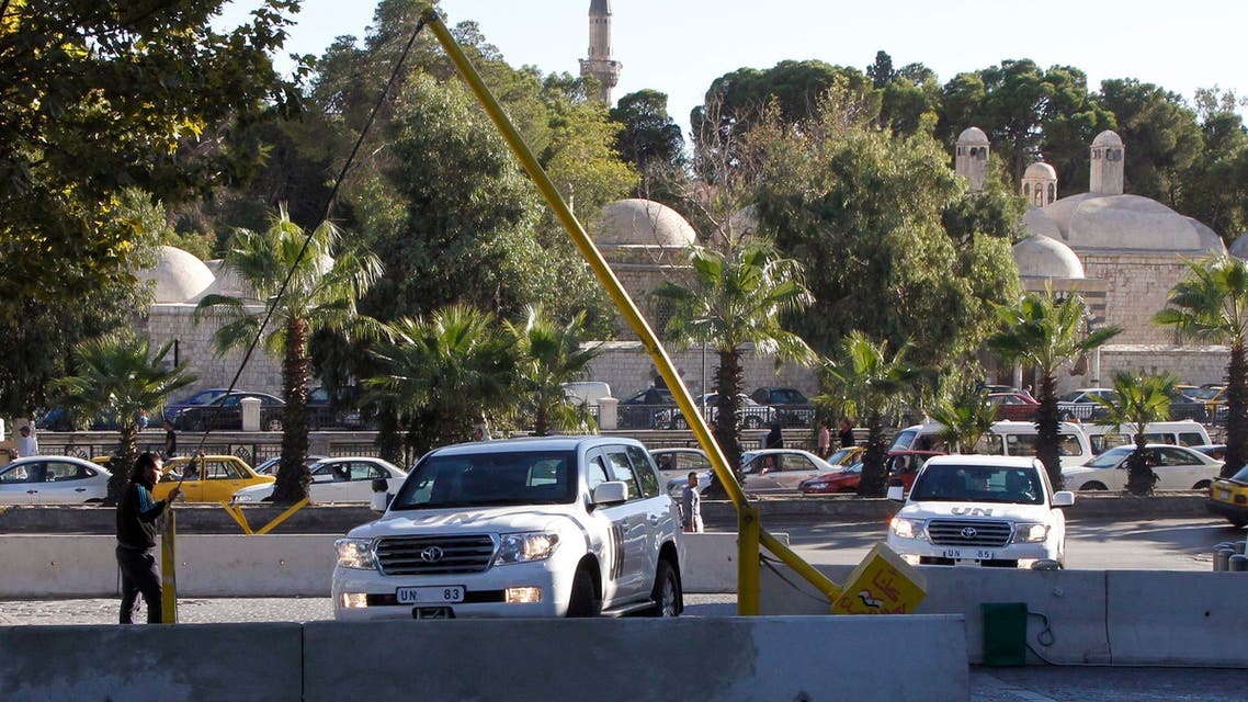 A U.N. convoy arrives at a hotel where experts from the Organization for the Prohibition of Chemical Weapons (OPCW) are staying, in Damascus October 9, 2013. (Reuters)