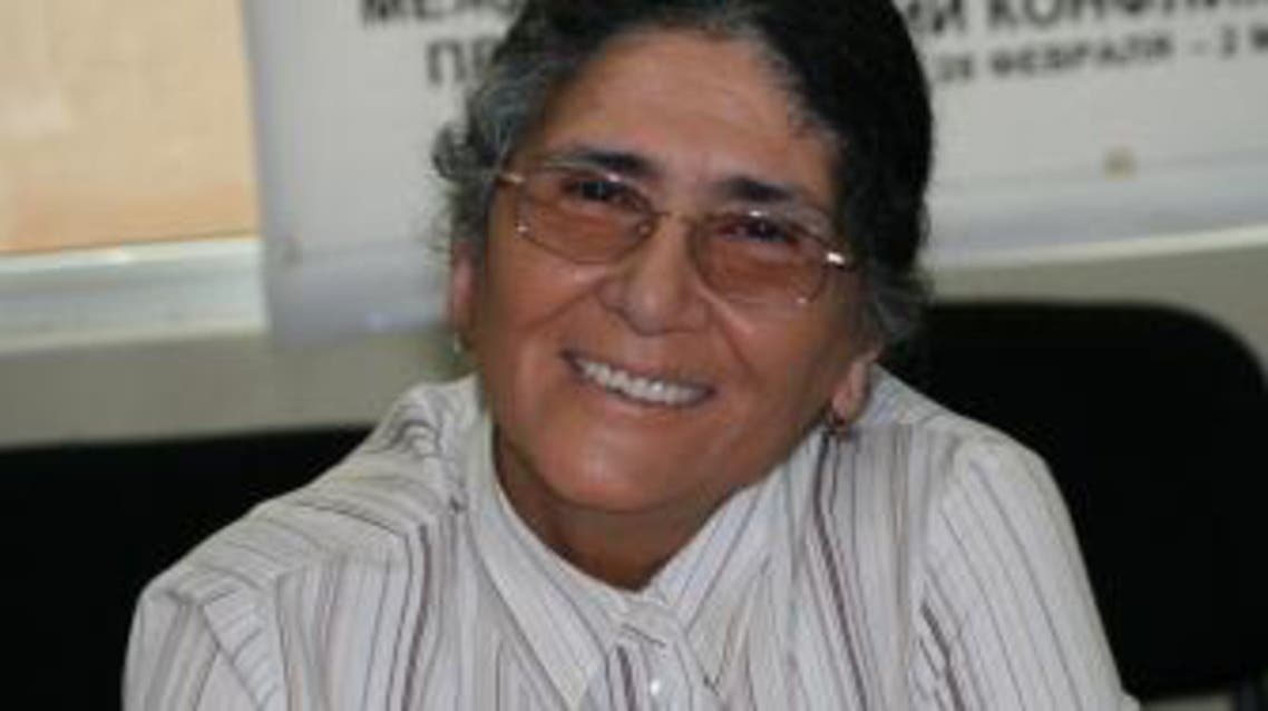 A file picture taken on July 15, 2013, shows Tajik lawyer and rights activist, Oinikhol Bobonazarova, smiles while attending a meeting in Dushanbe. Bobonazarova, 6