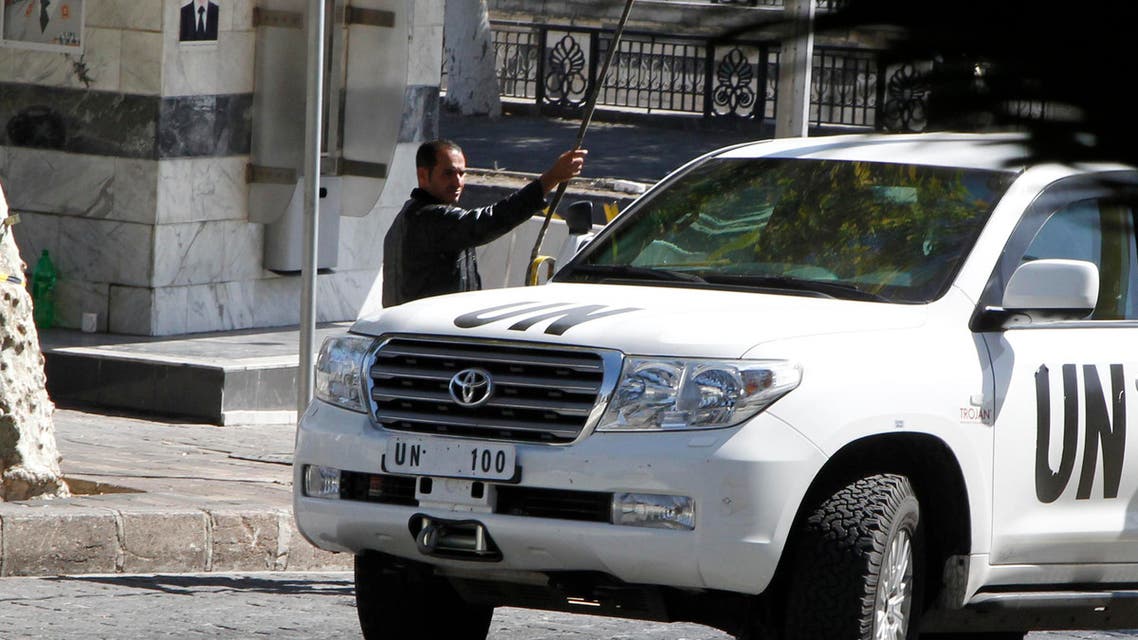 A U.N. vehicle returns to a hotel where experts from the Organisation for the Prohibition of Chemical Weapons (OPCW) are staying, in Damascus October 11, 2013. (Reuters)