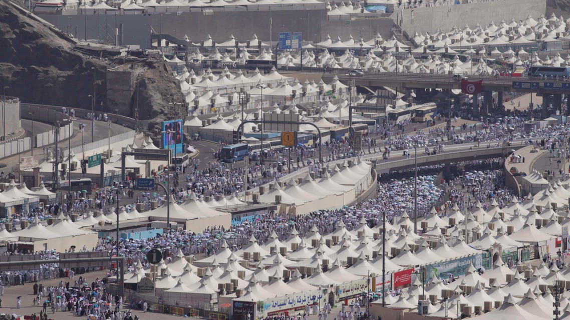 Muslim pilgrims arrive to cast seven pebbles at a pillar that symbolizes Satan during the annual haj pilgrimage, on the first day of Eid al-Adha in Mina, near Islam's holy city of Makkah, October 15, 2013. (Reuters)