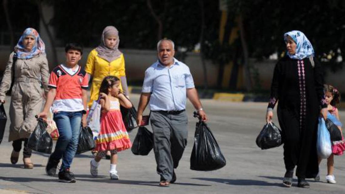 Amnesty said hundreds of refugees who fled Syria, including scores of children, face ongoing detention in poor conditions or deportation. (File photo: AFP)