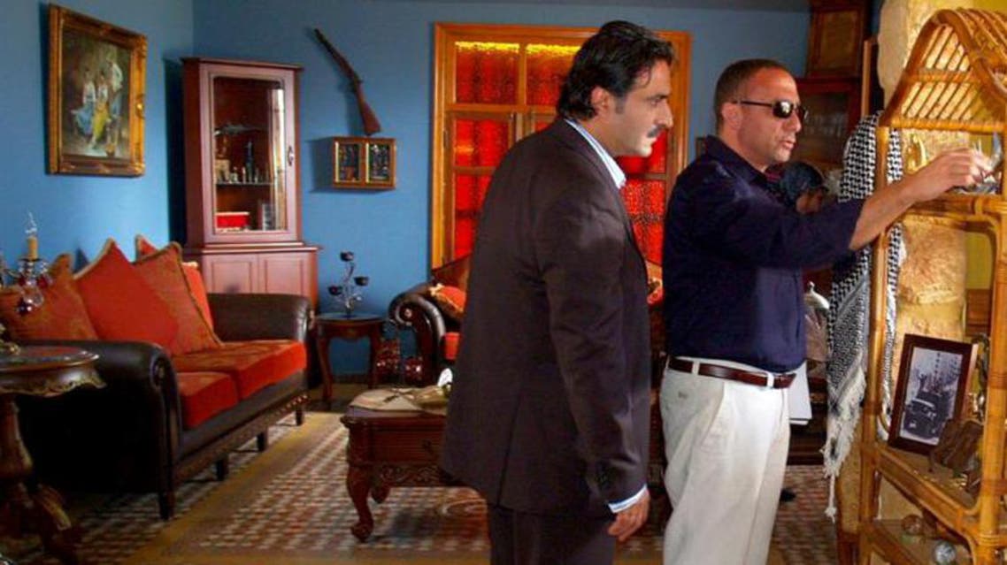 Director Basil Khatib (R) and Majdi Mashmoushi during the filming of "al-Ghaliboun." (Photo: Al-Akhbar)