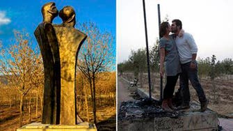 Iraqi couple protest statue vandalism with controversial kiss