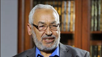 Tunisia’s Ennahda will give up government but not power, says party leader