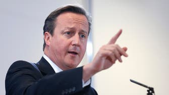 British PM Cameron threatens to act against press over leaks
