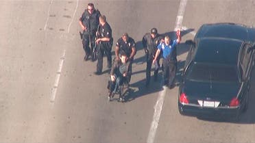 Police escort a man in a wheelchair toward medical help during an incident in which shots were fired at Los Angeles International Airport in Los Angeles in this still image taken from video provided by KNBC Nov. 1, 2013. (Reuters)