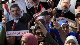 Mursi goes on trial as Egypt struggles for democracy