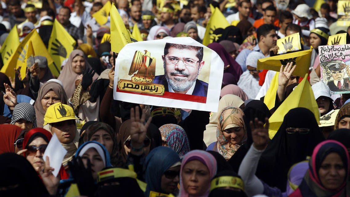 Supporters of the Muslim Brotherhood and ousted Egyptian President Mohammad Mursi take part in a protest against the military and interior ministry in a suburb on the outskirts of Cairo, November 1, 2013. (Reuters)