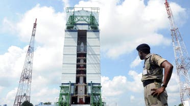This photograph shows an Indian security forces member keeping watch near the PSLV-C25 launch vehicle, carrying the Mars Orbiter probe as its payload, at the Indian Space Research Organization facility in Sriharikota. (AFP)