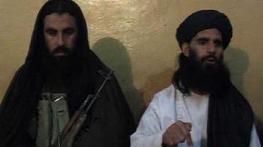 Smatullah Shaheen (R) caretaker chief Tehreek-e-Taliban Pakistan (TTP) announcing the new leader of TTP during a press conference in an undisclosed location in northwest Pakistan. (AFP)