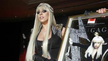 U.S. singer Lady Gaga poses with a plaque presented to her by Universal Music Group during a media event. (File photo: Reuters)