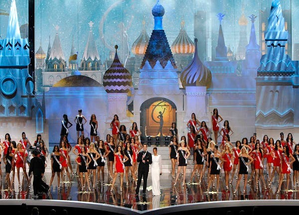 Contestants line up on stage with hosts Thomas Roberts and Mel B during the Miss Universe 2013 pageant at the Crocus City Hall in Moscow Nov. 9, 2013. (Reuters)