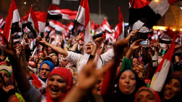 Protesters, who are against Egyptian President Mohamed Mursi, react in Tahrir Square in Cairo July 3, 2013. (Reuters)