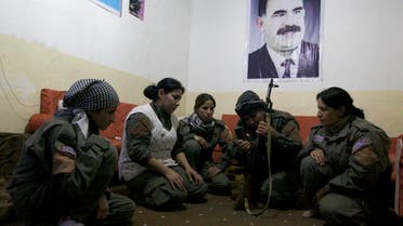 Female members of the Kurdish police, also known as Asayis, sit together as a fellow member trains them on how to use a weapon at their headquarters in Qamshli Nov. 8, 2013. (Reuters)