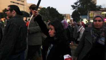 A woman raises a knife and shouts slogans against then Egyptian President Mohamed Mursi and the Brotherhood a during march against sexual harassment and violence against women in Cairo. (File Photo: Reuters)