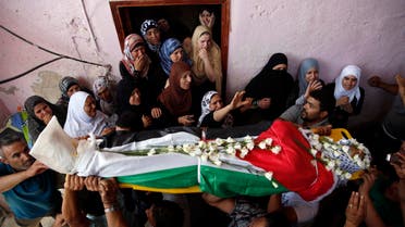 Palestinians carry the body of Jihad Aslan during his funeral at Qalandiya Refugee Camp near the West Bank city of Ramallah Aug. 26, 2013. (Reuters)