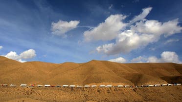 Hundreds of trucks bringing in diesel from Iran line up on a road as they head to the eastern province of Van in Turkey November 30, 2005.  (Reuters)