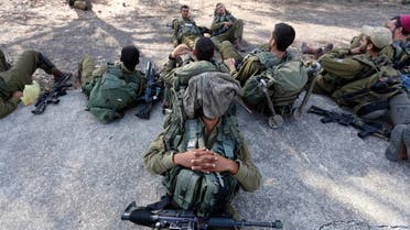 Israeli soldiers rest during a drill in the Israeli-occupied Golan Heights Aug. 28, 2013. (Reuters)