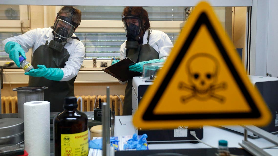 Employees of the Research Institute for Protective Technologies, Nuclear, Biological and Chemical Protection (WIS) inspect a dummy sample which is contaminated with a substance similar to the chemical weapon Sarin reuters