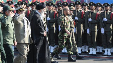 Iran's Supreme Leader Ayatollah Ali Khamenei (L centre) reviews an honor guard during the Iranian army land force academy graduating ceremony in Tehran November 10, 2011.
