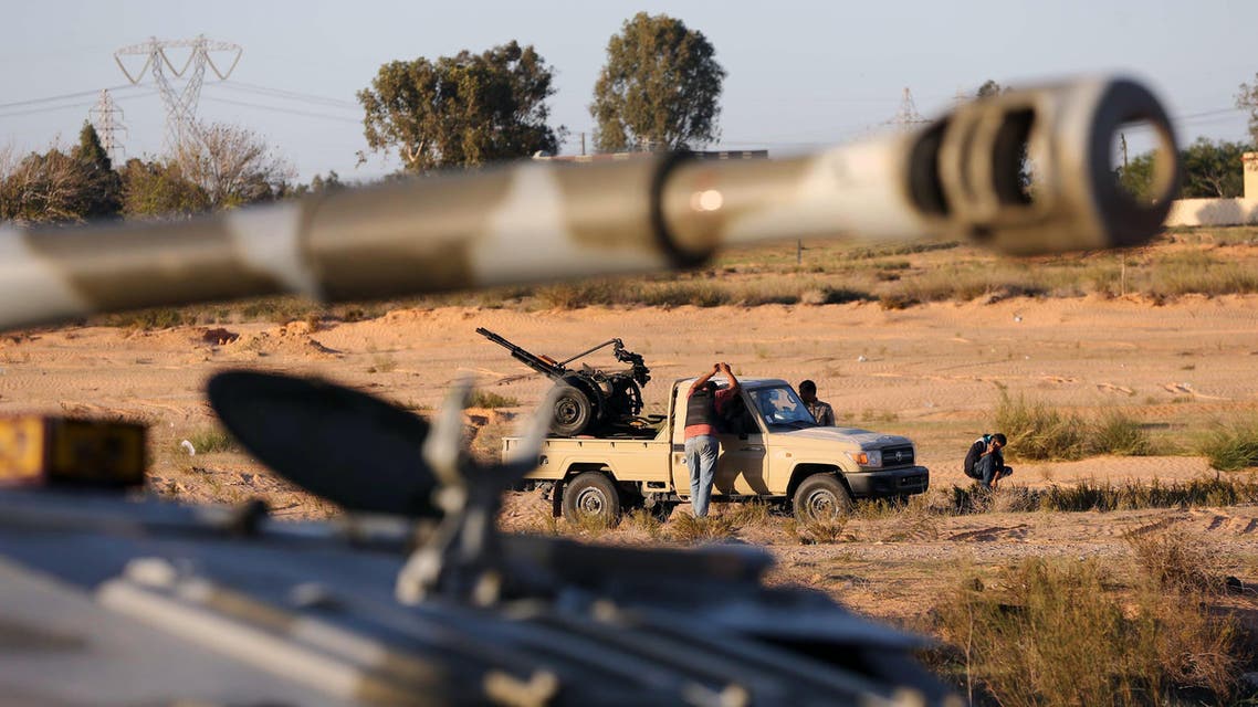 Members of the Tripoli Rebels Brigade militia patrol a main road in Tajura, 15 kms from the capital Tripoli, on November 16, 2013, afp
