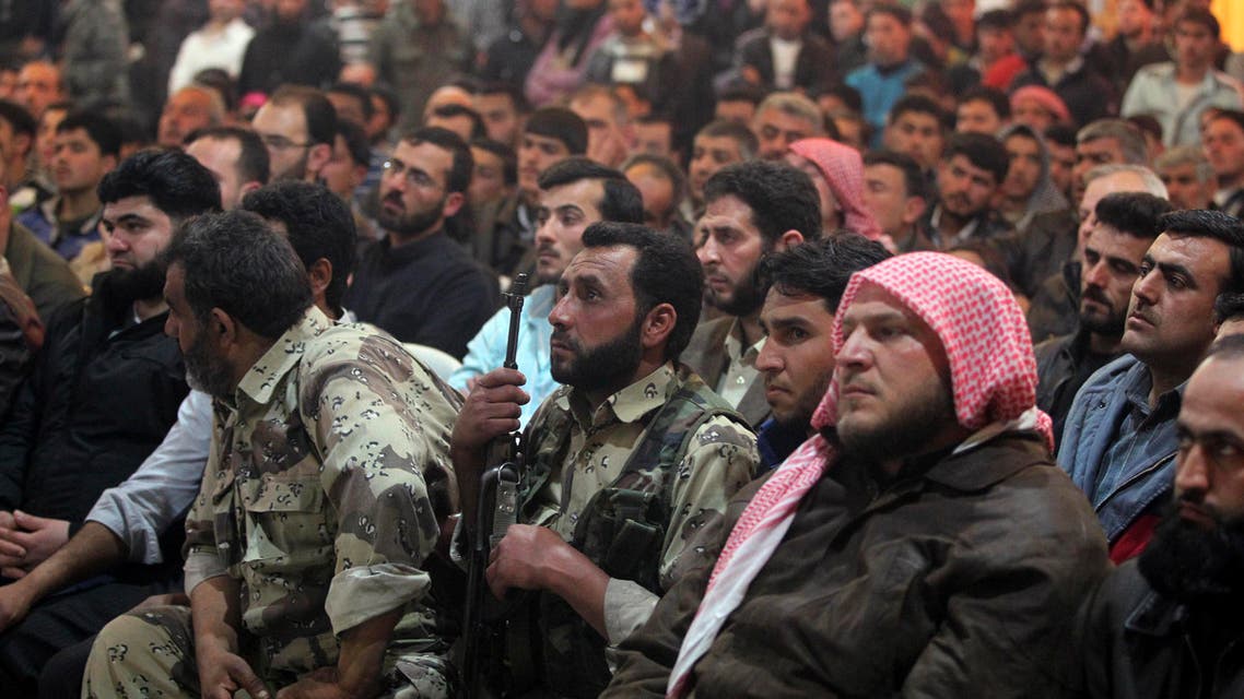 Residents and Free Syrian Army fighters attend a wedding ceremony in Aleppo's countryside city of al-Bab March 15, 2013. (Reuters)