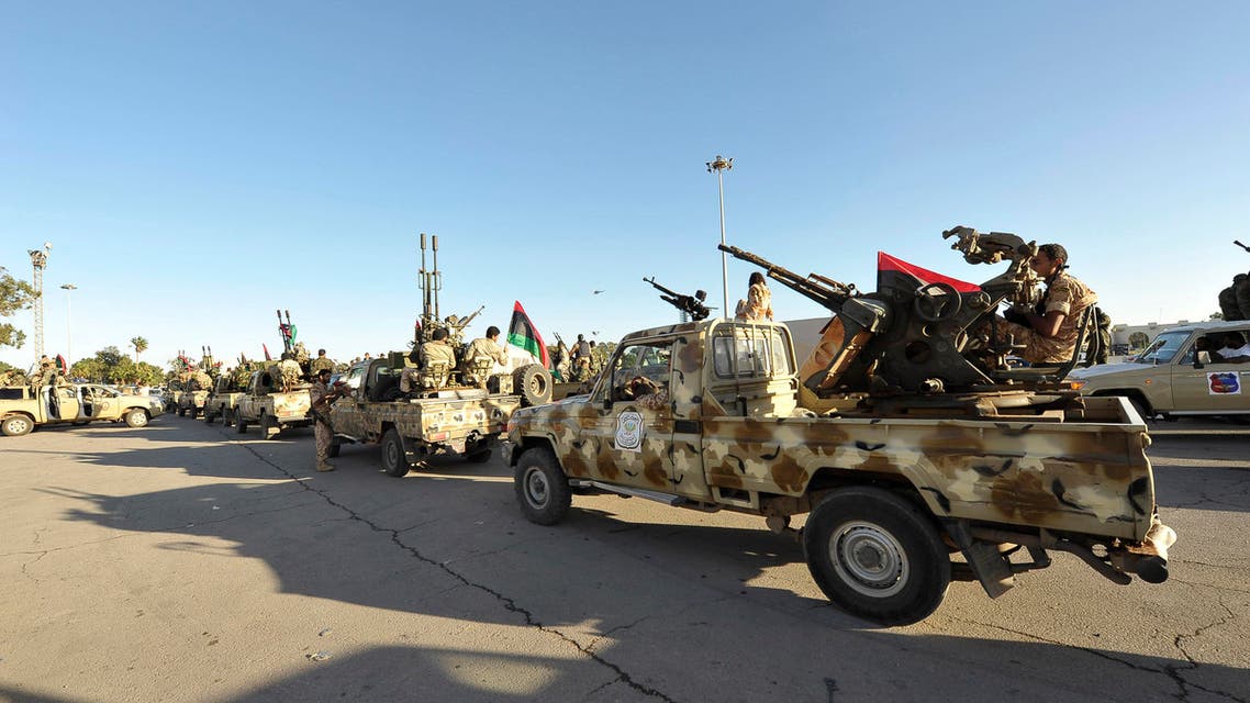 Demonstrators protest against armed militias as they welcome the arrival of the Libyan army in Benghazi, November 8, 2013.