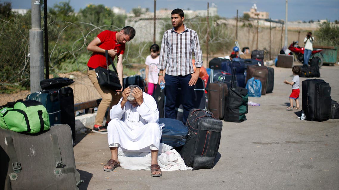 Palestinian passengers hoping to cross into Egypt, wait at the Rafah crossing between Egypt and the southern Gaza Strip Sept. 29, 2013. (Reuters)
