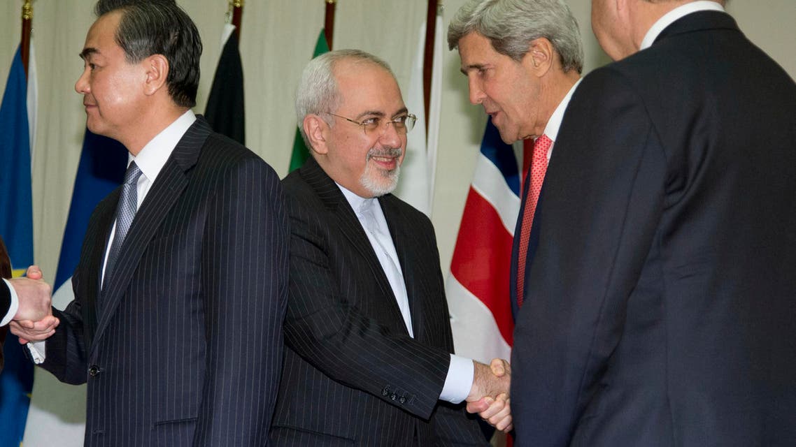 Iran’s Foreign Minister Mohammad Javad Zarif shakes hands with U.S. Secretary of State John Kerry after a breakthrough agreement early on Sunday. (Reuters)