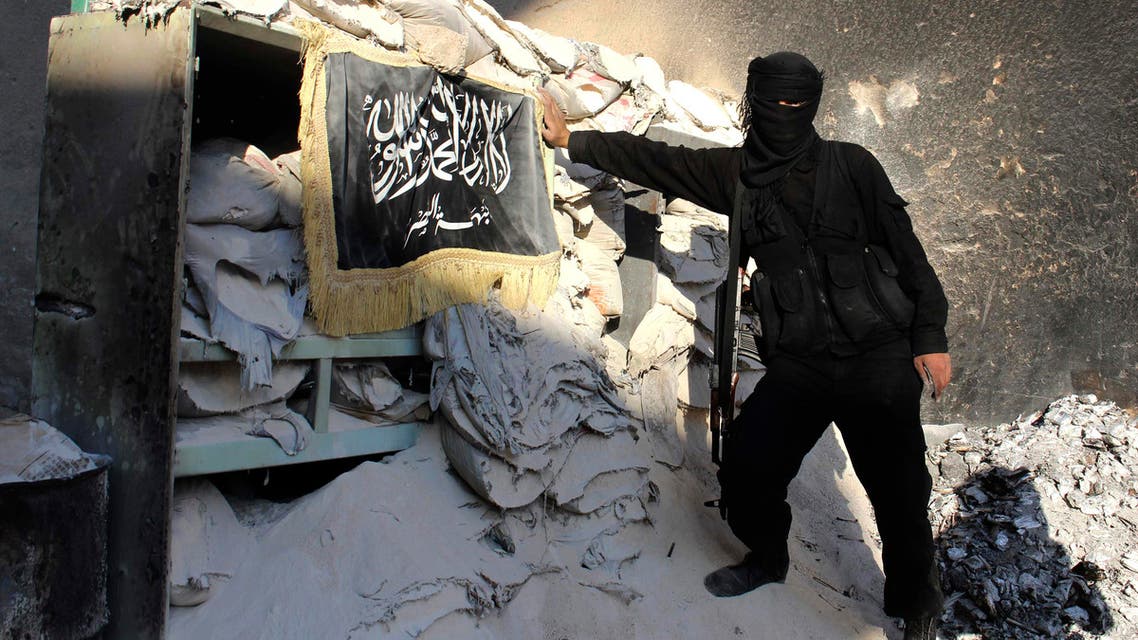 A Fighter from Islamist Syrian rebel group Jabhat al-Nusra poses at a checkpoint in Aleppo's Bustan al-Qasr, October 26, 2013. (Reuters)