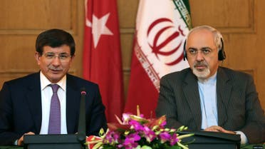 Iranian Foreign Minister Mohammad Javad Zarif (R) gives a joint press conference with his Turkish counterpart Ahmet Davutoglu on Nov. 27, 2013. (Reuters)