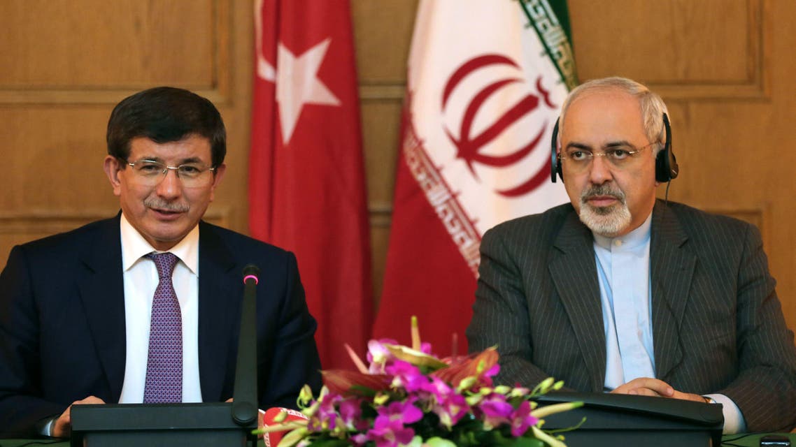 Iranian Foreign Minister Mohammad Javad Zarif (R) gives a joint press conference with his Turkish counterpart Ahmet Davutoglu on Nov. 27, 2013. (Reuters)