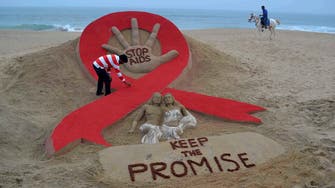 Suu Kyi urges ‘freedom from fear’ on World Aids Day 