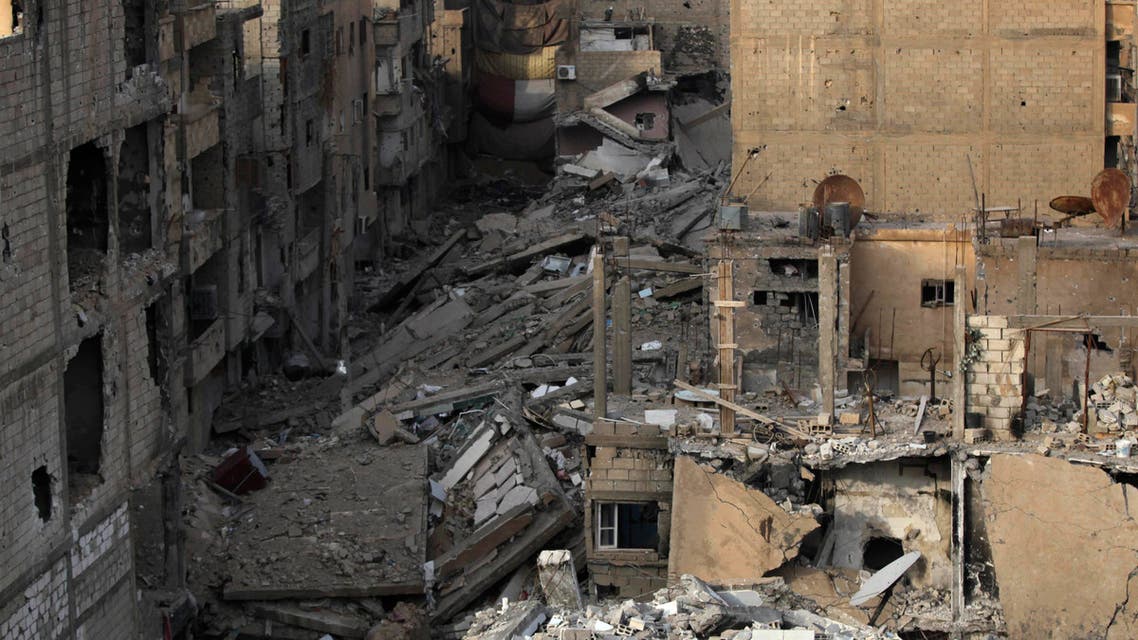 A general view shows buildings damaged in Deir al-Zor, eastern Syria, November 28, 2013