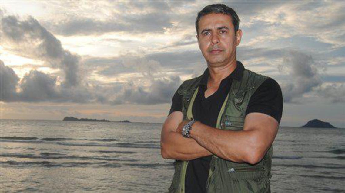 In this photo taken on June 11, 2012, Baker Abdulah Atyani, poses by the sea wall in Jolo, the capital of the island province of Sulu during his taping of his story of the island, a hotbed of Muslim militants.(AP)