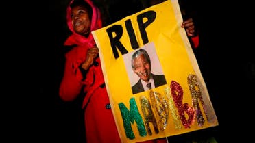 Mourners commemorate the death of Nelson Mandela