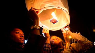 Mourners commemorate the death of Nelson Mandela