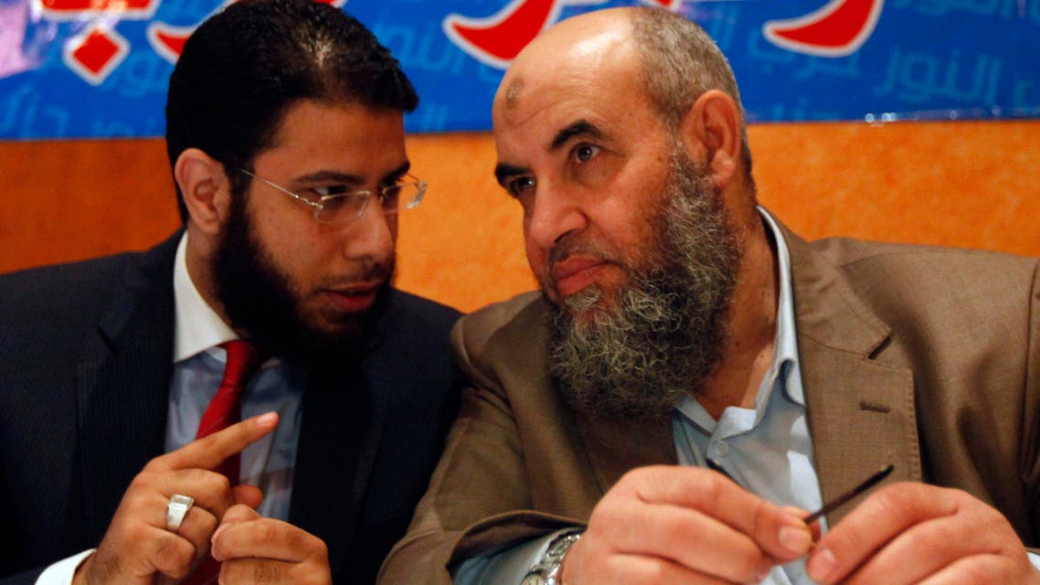 Younes Makhyoun (R), the head of the Nour party, listens to party spokesman Nader Bakkar during a news conference about constitution in Cairo Dec. 5, 2013. (Reuters)
