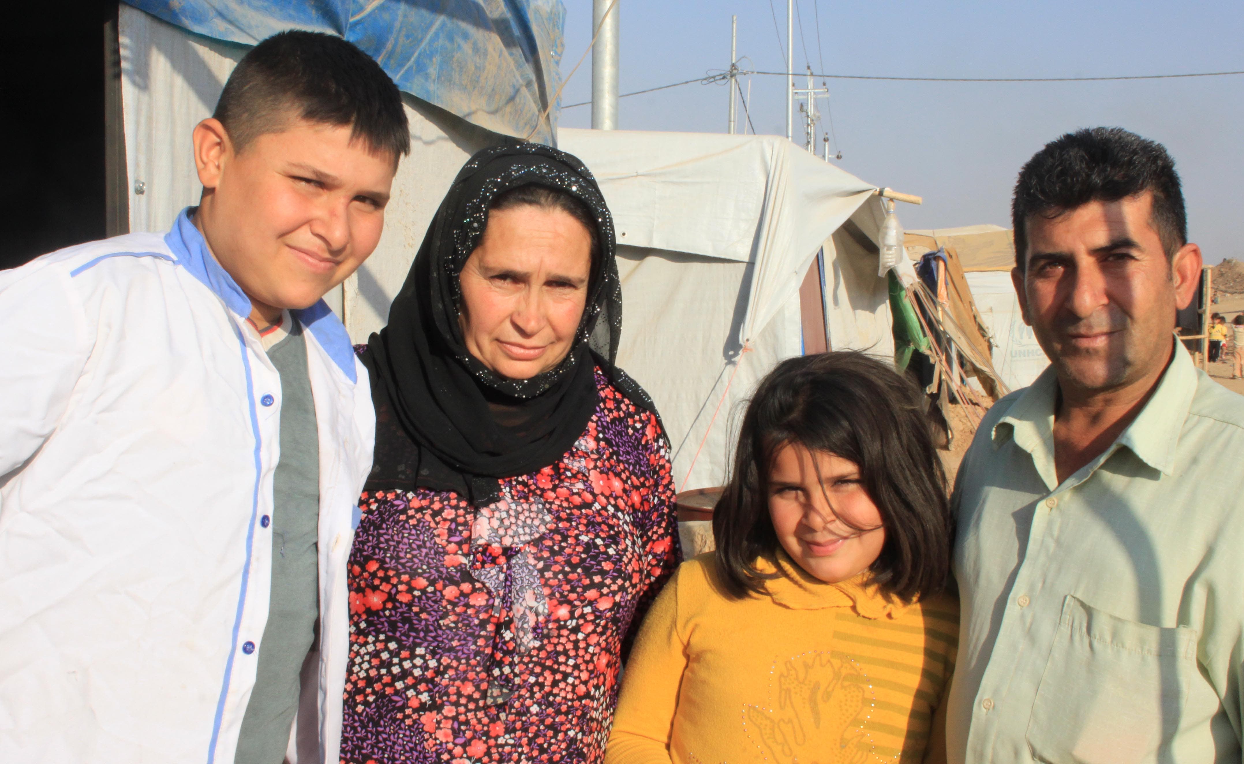 Qamarhan and family in their tent on the outskirts of Domiz. 