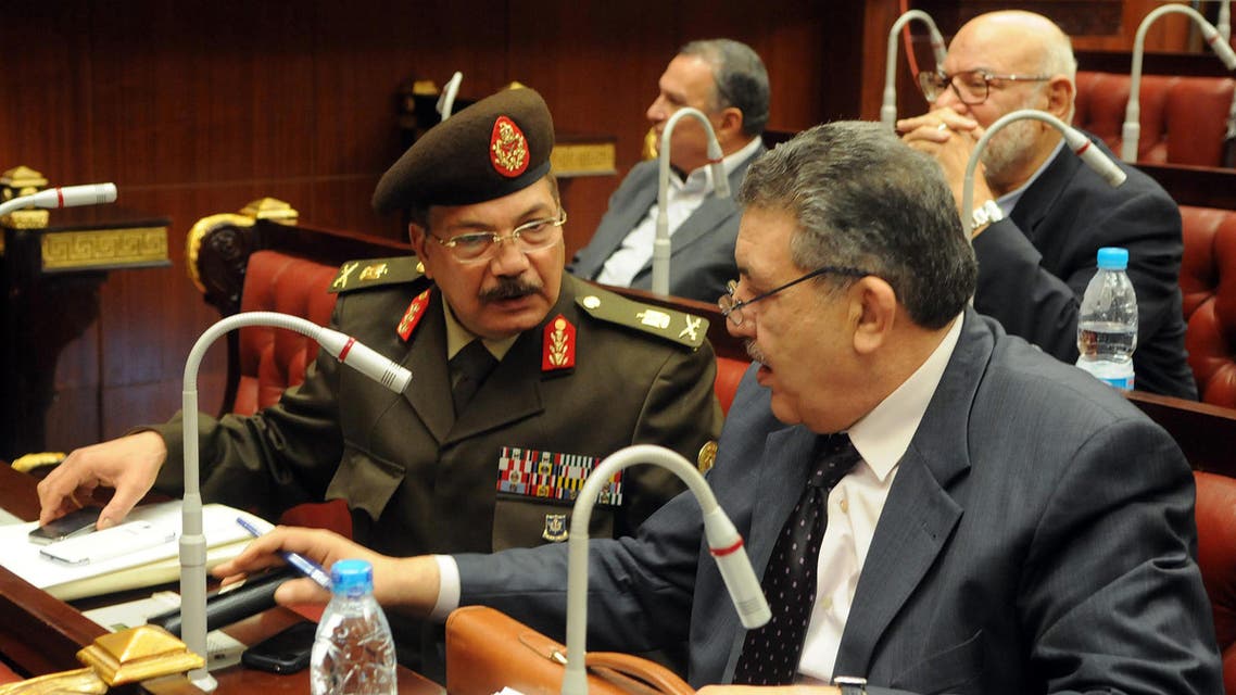 General Mohamed Magd El Din Barakat of the Egyptian army (L) speaks with his colleague, who is a member of the assembly writing Egypt's new constitution reuters