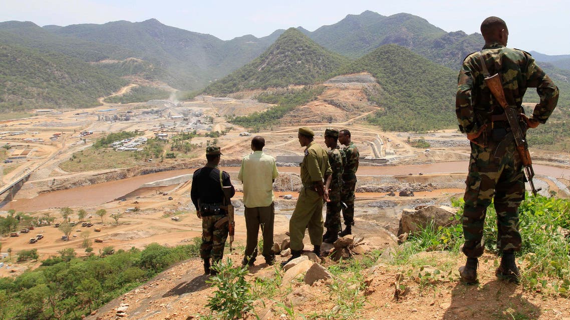 Security guards look at the construction of Ethiopia's Great Renaissance Dam in Guba Woreda, some 40 km (25 miles) from Ethiopia's border with Sudan, June 28, 2013. reu