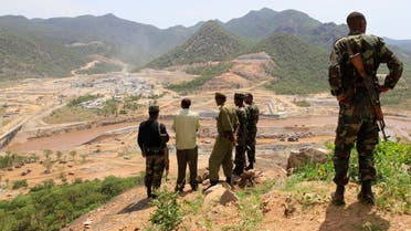 Security guards look at the construction of Ethiopia's Great Renaissance Dam in Guba Woreda, some 40 km (25 miles) from Ethiopia's border with Sudan, June 28, 2013. reu