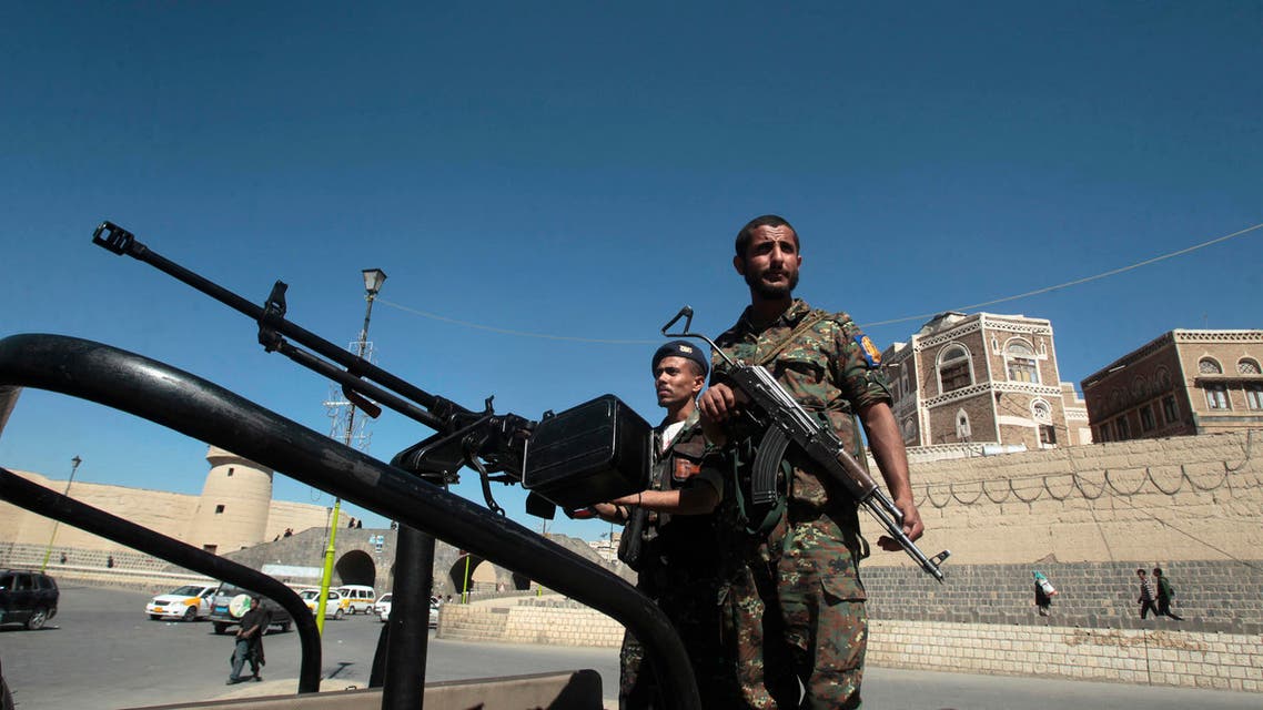 Police troopers stand guard on a police truck securing the vicinity of the Defence Ministry compound in Sanaa December 7, 2013. reuters