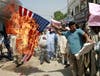 Pakistani traders burn a U.S. flag to protest against strikes in Pakistani tribal areas along the Afghan border, pictured on Sept. 10, 2008. (File photo: Reuters)