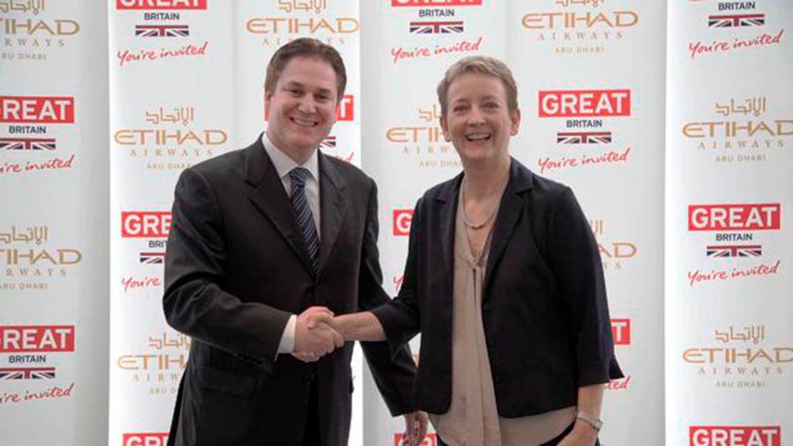 Peter Baumgartner, chief commercial officer at Etihad, and Sandie Dawe, chief executive of VisitBritain, signed a memorandum of understanding in Abu Dhabi. (Image courtesy: VisitBritain)