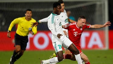 Kouko Guehi (L) of Morocco's Raja Casablanca fights for the ball with Franck Ribery of Germany's Bayern Munich during their 2013 FIFA Club World Cup final soccer match at Marrakech stadium Dec. 21, 2013. Reuters