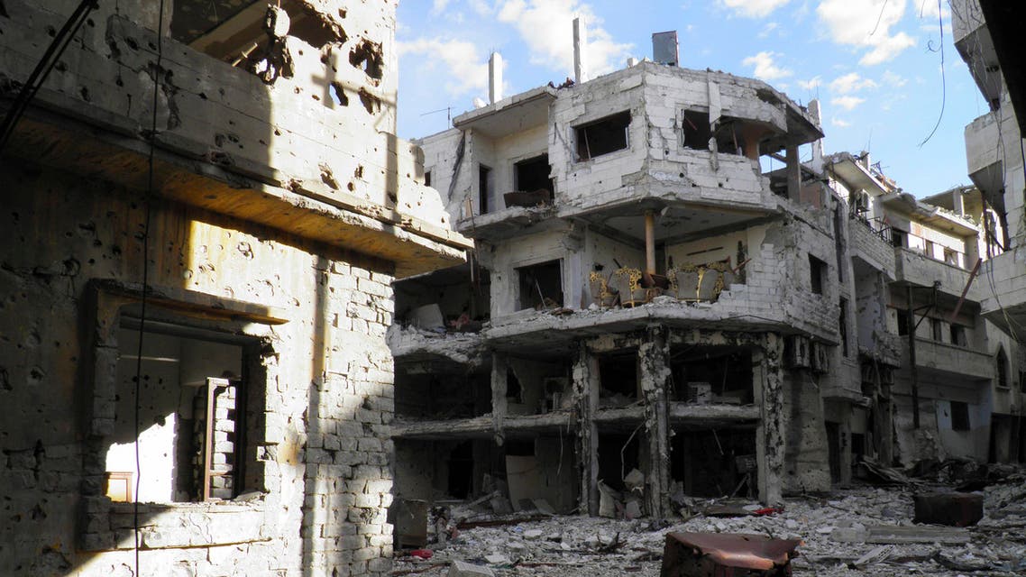 A sitting room (top, C) lies in a damaged house inside the besieged area of Homs November 28, 2013. (Reuters)